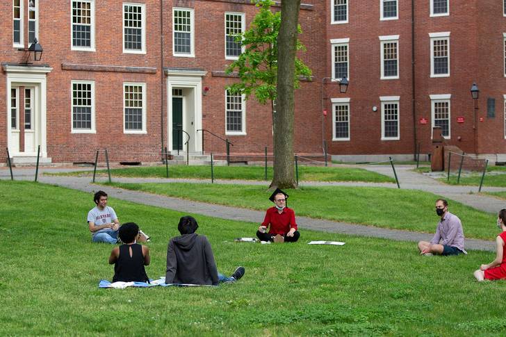 Friends of Harvard Law School Class of 2020 Graduate Jesse Burbank (4R) sit in a large circle in Harvard Yard to celebrate his graduation, on what would have been the 369th Commencement of Harvard University in Cambridge, Massachusetts, USA, 28 May 2020.